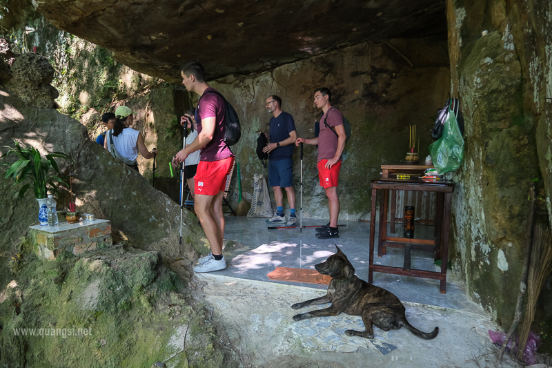 a group of people standing in a cave