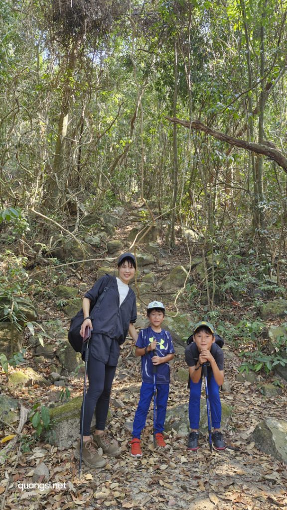 a woman and two kids posing for a picture